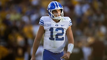 Nov 23, 2024; Tempe, Arizona, USA; Brigham Young Cougars quarterback Jake Retzlaff (12) against the Arizona State Sun Devils at Mountain America Stadium. Mandatory Credit: Mark J. Rebilas-Imagn Images