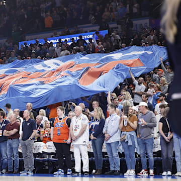 Mar 29, 2024; Oklahoma City, Oklahoma, USA; Oklahoma City Thunder fans pass a giant flag through the crowd before the start of a game against the Phoenix Suns at Paycom Center