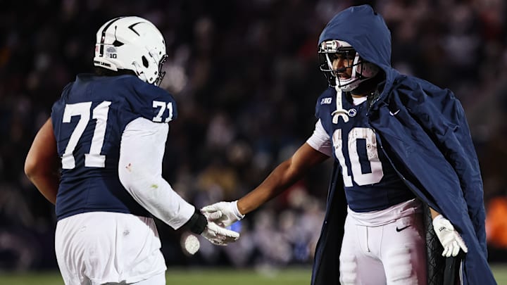 Penn State football offensive lineman Olaivavega Ioane and running back Nicholas Singleton