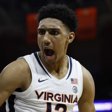 Jan 24, 2024; Charlottesville, Virginia, USA; Virginia Cavaliers guard Ryan Dunn (13) reacts after a dunk against the North Carolina State Wolfpack in overtime at John Paul Jones Arena. Mandatory Credit: Geoff Burke-USA TODAY Sports
