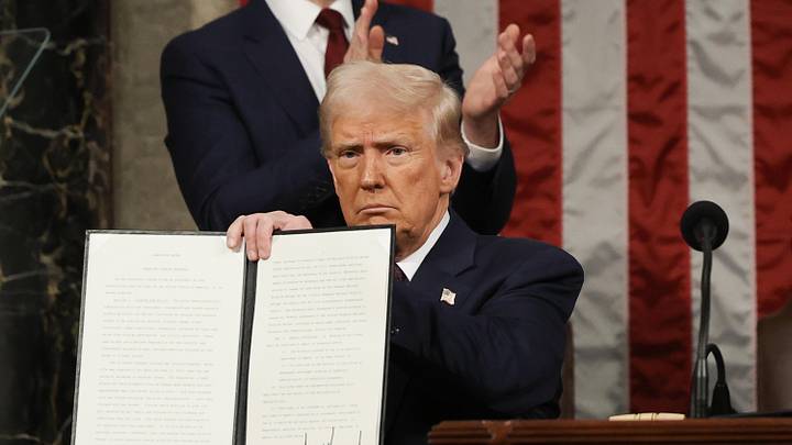 Mar 4, 2025; Washington, DC, USA; U.S. President Donald Trump holds a copy of an executive order honoring Jocelyn Nungaray, a a 12-year-old girl who was killed by illegal immigrants, as he addresses a joint session of Congress at the U.S. Capitol on March 04, 2025 in Washington, DC. President Trump was expected to address Congress on his early achievements of his presidency and his upcoming legislative agenda. Mandatory Credit: Win McNamee-Pool via Imagn Images