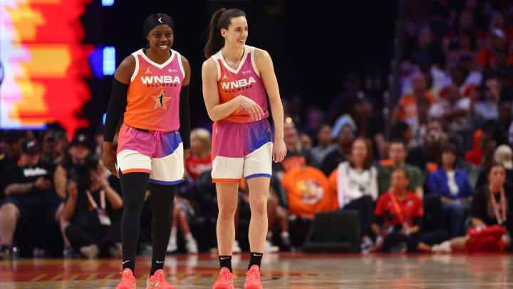 Jul 20, 2024; Phoenix, AZ, USA; Team WNBA guard Caitlin Clark (22) and Team WNBA player Arike Ogunbowale (24) reacts after a play during the first half against the USA Women's National Team at Footprint Center. Mandatory Credit: Mark J. Rebilas-USA TODAY Sports