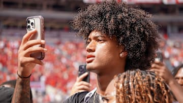Aug 31, 2024; Columbus, OH, USA; Mater Dei wide receiver Chris Henry Jr. films as Ohio State football warms up before the Buckeyes' 52-6 win over Akron.