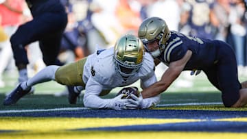 Oct 26, 2024; East Rutherford, New Jersey, USA; Notre Dame Fighting Irish linebacker Jaylen Sneed (3) recovers a fumble by Navy Midshipmen quarterback Blake Horvath (11) in the end zone for a defensive touchdown during the second half at MetLife Stadium. 