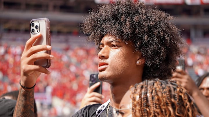 Aug 31, 2024; Columbus, OH, USA; Mater Dei wide receiver Chris Henry Jr. films as Ohio State football warms up before the Buckeyes' 52-6 win over Akron.