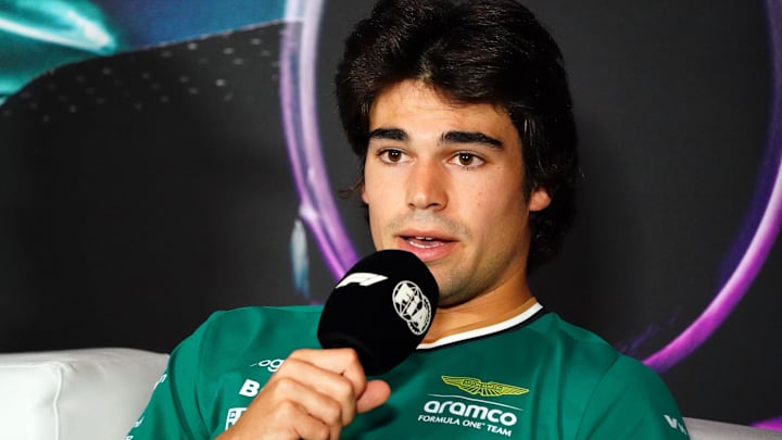 May 2, 2024; Miami Gardens, Florida, USA;  Aston Martin driver Lance Stroll (18) reacts to a question during a press conference in advance of the Miami Grand Prix at the Miami International Autodrome. Mandatory Credit: John David Mercer-Imagn Images