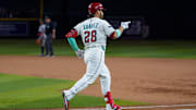Apr 26, 2025; Phoenix, Arizona, USA;  Arizona Diamondbacks infielder Eugenio Suarez (28) reacts after hitting his fourth home run of the game against the Atlanta Braves during the ninth inning at Chase Field. Mandatory Credit: Allan Henry-Imagn Images