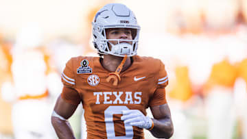 Dec 21, 2024; Austin, Texas, USA; Texas Longhorns wide receiver DeAndre Moore Jr. (0) against the Clemson Tigers during the CFP National playoff first round at Darrell K Royal-Texas Memorial Stadium. Mandatory Credit: Mark J. Rebilas-Imagn Images