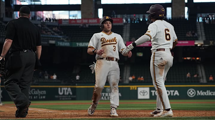 Feb 28, 2026; Arlington, TX, USA; Landon Hairston high-fives Nu'u Contrades during the Amegy Bank College Baseball Series at Globe Life Field. 