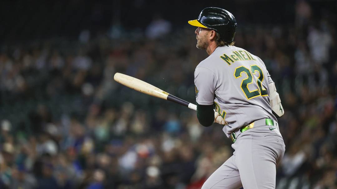 Apr 22, 2026; Seattle, Washington, USA; Athletics second baseman Jeff McNeil (22) hits an RBI-single against the Seattle Mariners during the first inning at T-Mobile Park. Mandatory Credit: Joe Nicholson-Imagn Images