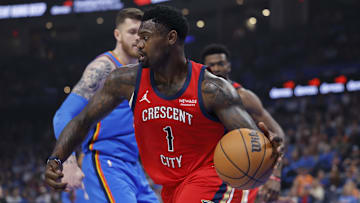 Nov 2, 2025; Oklahoma City, Oklahoma, USA;New Orleans Pelicans forward Zion Williamson (1) moves the ball around Oklahoma City Thunder center Isaiah Hartenstein (55) after a rebound during the first quarter at Paycom Center. Mandatory Credit: Alonzo Adams-Imagn Images