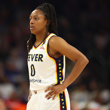 Jun 30, 2024; Phoenix, Arizona, USA; Indiana Fever guard Kelsey Mitchell (0) against the Phoenix Mercury during a WNBA game at Footprint Center. Mandatory Credit: Mark J. Rebilas-Imagn Images