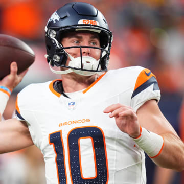 Aug 18, 2024; Denver, Colorado, USA; Denver Broncos quarterback Bo Nix warms up in the first quarter against the Green Bay Packers at Empower Field at Mile High. 