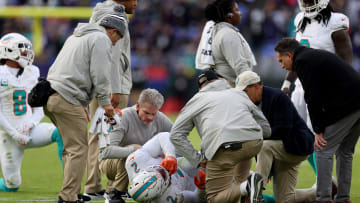 Bradley Chubb lays on the ground in pain before being taken off in a cart due to a knee injury that prematurely ended his season.