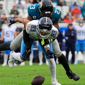 Jacksonville Jaguars linebacker Foyesade Oluokun (23) breaks up a pass intended for Tennessee Titans wide receiver Tyler Boyd (83) during the fourth quarter Sunday, Dec. 29, 2024 at EverBank Stadium in Jacksonville, Fla. The Jaguars held off the Titans 20-13. [Corey Perrine/Florida Times-Union]