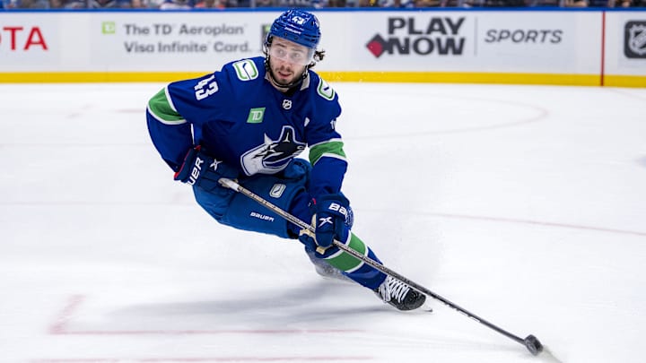 May 20, 2024; Vancouver, British Columbia, CAN; Vancouver Canucks defenseman Quinn Hughes (43) handles the puck against the Edmonton Oilers during the second period in game seven of the second round of the 2024 Stanley Cup Playoffs at Rogers Arena. Mandatory Credit: Bob Frid-Imagn Images