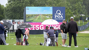 PGA Tour players hit the driving range during a practice round for the PGA Championship golf tournament at Quail Hollow