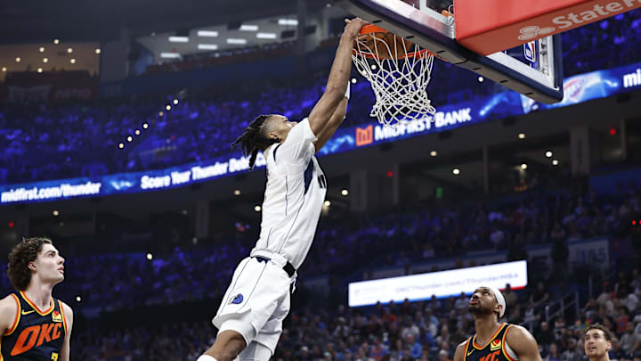 Apr 14, 2024; Oklahoma City, Oklahoma, USA; Dallas Mavericks forward Alex Fudge (3) dunks against the Oklahoma City Thunder during the second quarter at Paycom Center. Mandatory Credit: Alonzo Adams-Imagn Images