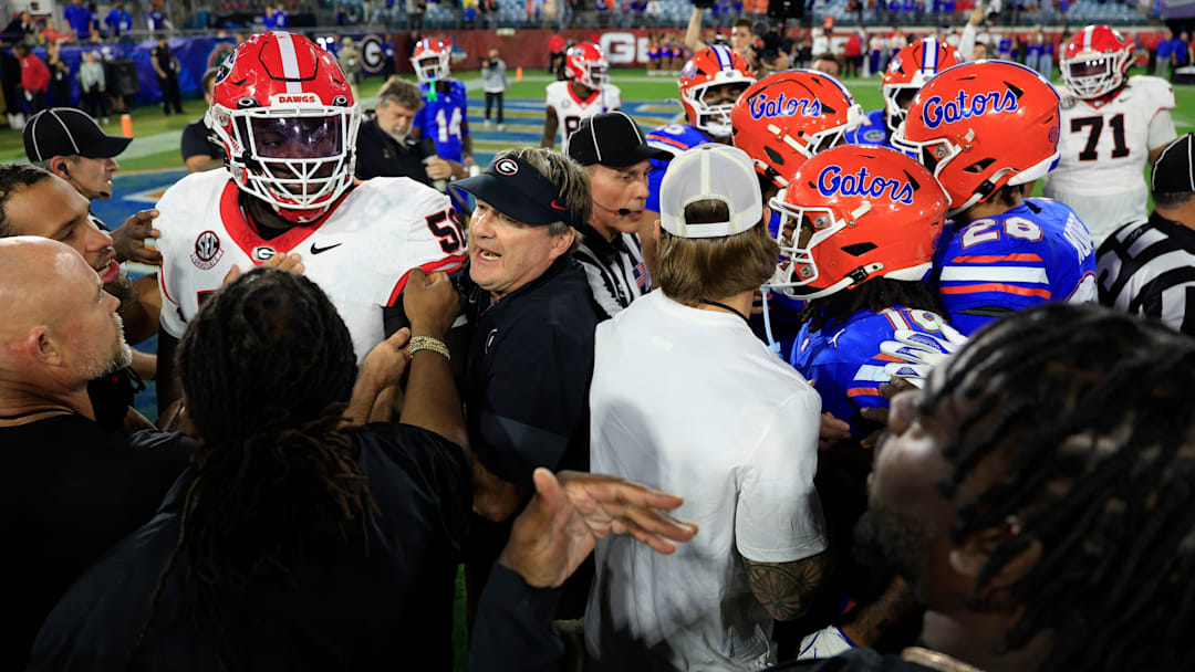 Georgia Bulldogs head coach Kirby Smart pulls offensive lineman Micah Morris (56) out after he lost his footing, and a small scuffle ensued after an NCAA football game.