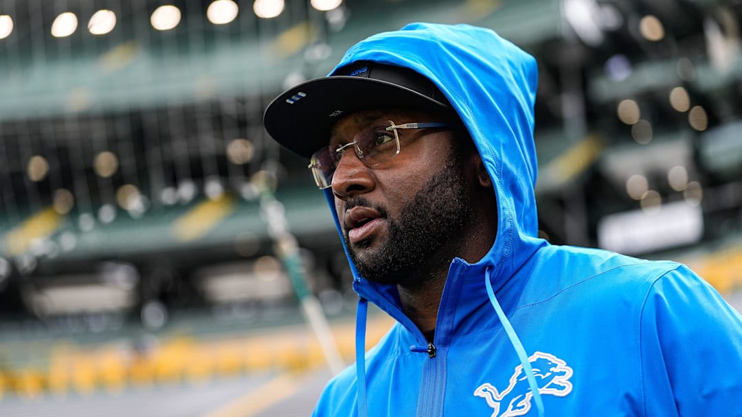 Detroit Lions defensive coordinator Kelvin Sheppard walks onto the field for warm up ahed of the Green Bay Packers game at Lambeau Field in Green Bay, Wis., on Sunday, September 7, 2025.