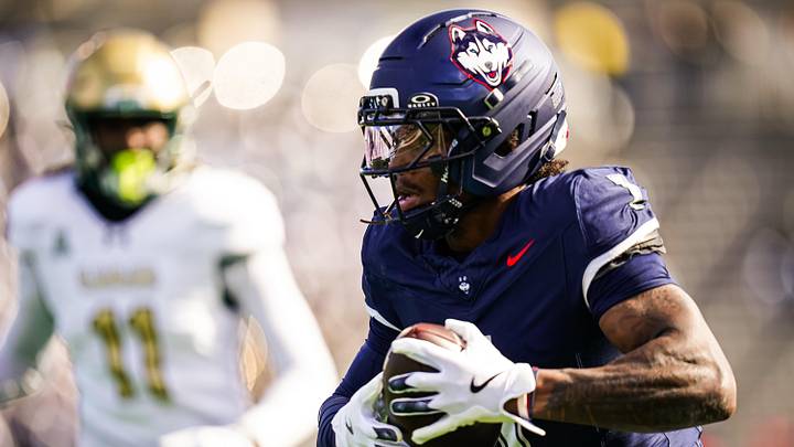 Nov 1, 2025; East Hartford, Connecticut, USA; UConn Huskies wide receiver Skyler Bell (1) makes the catch and runs for a touchdown against the UAB Blazers in the first quarter at Pratt & Whitney Stadium at Rentschler Field. Mandatory Credit: David Butler II-Imagn Images