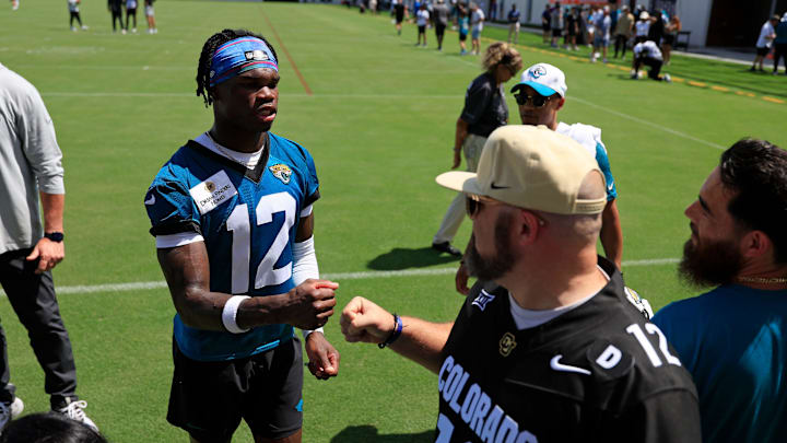 Jacksonville Jaguars wide receiver Travis Hunter (12) greets fans during the second mandatory minicamp at Miller Electric Center Wednesday, June 11, 2025 in Jacksonville, Fla. Jacksonville Jaguars wide receiver Travis Hunter (12) greets fans during the second mandatory minicamp at Miller Electric Center Wednesday, June 11, 2025 in Jacksonville, Fla.