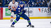 Nov 14, 2024; Vancouver, British Columbia, CAN; Vancouver Canucks forward Jonathan Lekkerimaki (23) handles the puck against the New York Islanders during the first period at Rogers Arena. Mandatory Credit: Bob Frid-Imagn Images
