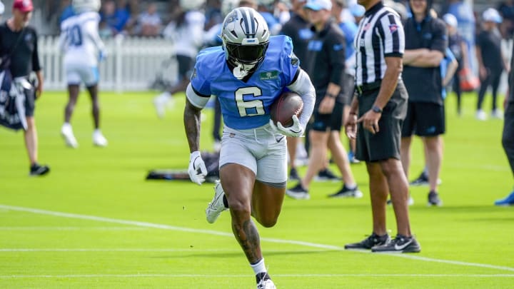 Jul 24, 2024; Charlotte, NC, USA; Carolina Panthers running back Miles Sanders (6) carries the ball at Carolina Panthers Practice Fields. 