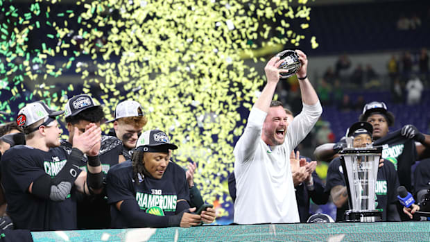 Oregon Ducks head coach Dan Lanning and the Oregon Ducks celebrate defeating the Penn State Nittany Lions to win the Big Ten 