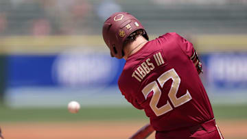 May 25, 2024; Charlotte, NC, USA; Florida State outfielder James Tibbs III (22) hits a ball in the second inning against Wake Forest during the ACC Baseball Tournament at Truist Field. Mandatory Credit: Cory Knowlton-Imagn Images