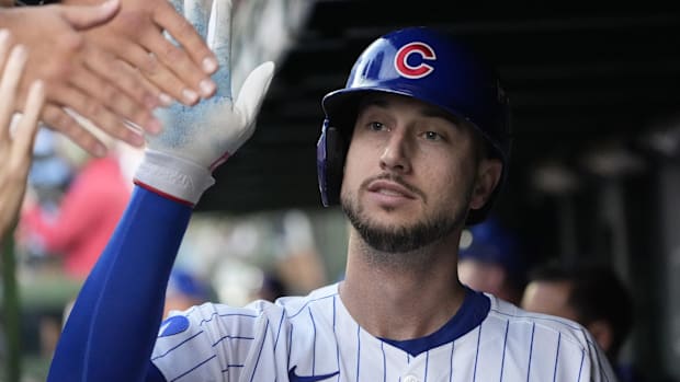 Chicago Cubs outfielder Kyle Tucker (30) is greeted in the dugout on October 2, 2025