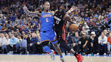 Feb 12, 2025; Oklahoma City, Oklahoma, USA;Miami Heat center Bam Adebayo (13) drives to the basket beside Oklahoma City Thunder forward Jaylin Williams (6) during the second quarter at Paycom Center. Mandatory Credit: Alonzo Adams-Imagn Images
