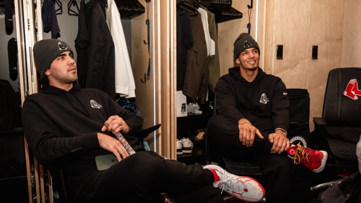 Red Sox prospects Marcelo Mayer (left) and Vaughn Grissom take a seat inside the Red Sox clubhouse