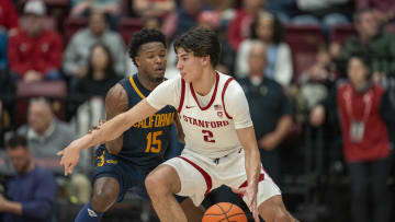 Mar 7, 2024; Stanford, California, USA; California Golden Bears guard Jalen Cone (15) defends against Stanford Cardinal guard Andrej Stojakovic (2) during the second half at Maples Pavillion. Mandatory Credit: Neville E. Guard-USA TODAY Sports
