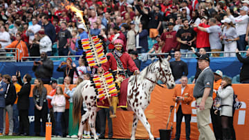 Dec 30, 2023; Miami Gardens, FL, USA; Florida State Seminoles mascot Chief Osceola and Renegade take the field before the game in the 2023 Orange Bowl against the Georgia Bulldogs at Hard Rock Stadium. Mandatory Credit: Nathan Ray Seebeck-Imagn Images
