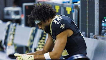 Sep 22, 2024; New Orleans, Louisiana, USA; New Orleans Saints wide receiver Chris Olave (12) reacts to a play in the final minute of the game against the Philadelphia Eagles during the second half at Caesars Superdome. Mandatory Credit: Stephen Lew-Imagn Images