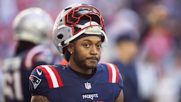 Dec 15, 2024; Glendale, Arizona, USA; New England Patriots running back Antonio Gibson (4) against the Arizona Cardinals at State Farm Stadium. Mandatory Credit: Mark J. Rebilas-Imagn Images