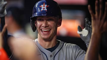Houston Astros left fielder Zach Cole (16) celebrates with teammates after a two-run home run against the Atlanta Braves in the third inning at Truist Park.