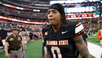 Oklahoma State's Ollie Gordon II (0) walks of the field following the Big 12 Football Championship game between the Oklahoma State University Cowboys and the Texas Longhorns at the AT&T Stadium in Arlington, Texas, Saturday, Dec. 2, 2023.