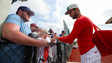 Philadelphia Phillies shortstop Trea Turner (7) signs autographs for fans during spring training workouts at BayCare Ballpark.
