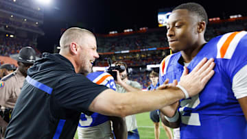 Oct 18, 2025; Gainesville, Florida, USA; Florida Gators head coach Billy Napier celebrates with quarterback DJ Lagway (2) after a game against the Mississippi State Bulldogs at Ben Hill Griffin Stadium. Mandatory Credit: Matt Pendleton-Imagn Images