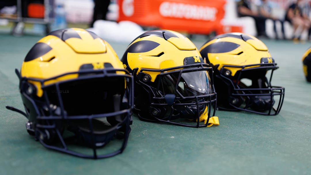 Dec 31, 2024; Tampa, FL, USA; Michigan Wolverines helmets sit on the field before a game against the Alabama Crimson Tide at Raymond James Stadium. Mandatory Credit: Matt Pendleton-Imagn Images