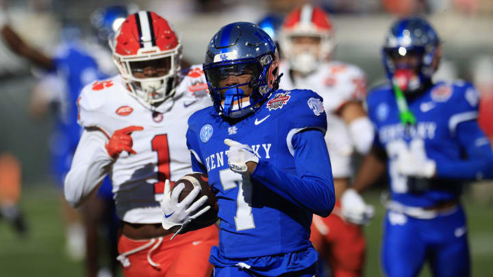 Kentucky Wildcats wide receiver Barion Brown (7) scores a touchdown during the third quarter of an NCAA football matchup in the TaxSlayer Gator Bowl Friday, Dec. 29, 2023 at EverBank Stadium in Jacksonville, Fla. The Clemson Tigers edged the Kentucky Wildcats 38-35. [Corey Perrine/Florida Times-Union]