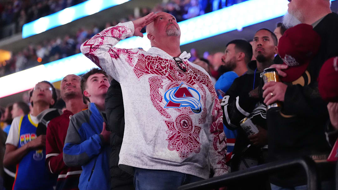 Jan 16, 2026; Denver, Colorado, USA; Colorado Avalanche fan salutes before the game against the Nashville Predators at Ball Arena. Mandatory Credit: Ron Chenoy-Imagn Images