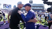 Kansas State Wildcats head coach Chris Klieman meets with UCF Knights head coach Scott Frost after the game against UCF Knights at Bill Snyder Family Stadium on Sept. 27, 2025.