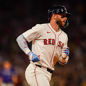 Jul 8, 2025; Boston, Massachusetts, USA; Boston Red Sox shortstop Trevor Story (10) hits a two run home run against the Colorado Rockies in the seventh inning at Fenway Park. Mandatory Credit: David Butler II-Imagn Images