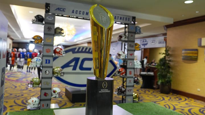 Jul 22, 2024; Charlotte, NC, USA; The CFP National Championship trophy is seen during the ACC Kickoff at Hilton Charlotte Uptown. Mandatory Credit: Jim Dedmon-USA TODAY Sports