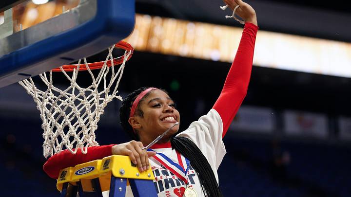 Sacred Heart's Zakiyah Johnson celebrates her piece of the net after they beat McCracken County in the Mingua Beef Jerky Sweet 16 Girl's Basketball Championship. Mar. 16, 2024