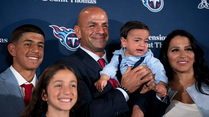 Tennessee Titans new head coach Robert Saleh, center, poses with his family, including wife, Sanaa Saleh, and youngest child, Robert Jr., after the new head coach’s introductory press conference at Ascension Saint Thomas Sports Park in Nashville, Tenn., Thursday, Jan. 29, 2026.