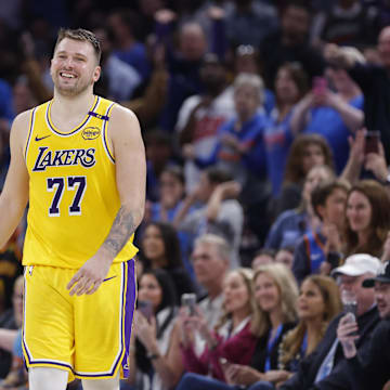 Apr 8, 2025; Oklahoma City, Oklahoma, USA; Los Angeles Lakers guard Luka Doncic (77) smiles after a technical is called against him during the second half of a game against the Oklahoma City Thunder at Paycom Center. Mandatory Credit: Alonzo Adams-Imagn Images